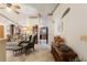 Bright living room with comfortable seating and view into kitchen at 4680 Poinciana Dr, Indian Lake Estates, FL 33855