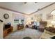 Living room with two recliners and built-in shelving at 4680 Poinciana Dr, Indian Lake Estates, FL 33855