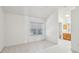Bright, spacious bedroom with tile flooring, a large window, and an ensuite bathroom at 515 Torres Pl, Lady Lake, FL 32159