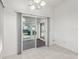 Bright dining room with tile flooring, a sliding door to the patio, and a modern light fixture at 515 Torres Pl, Lady Lake, FL 32159