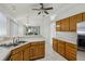Bright and airy kitchen with modern appliances, neutral countertops, and ample counter space at 515 Torres Pl, Lady Lake, FL 32159