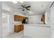 Kitchen features tile floors, ample cabinetry, and a breakfast bar with an open view of the home at 515 Torres Pl, Lady Lake, FL 32159
