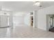 Spacious living area with tile flooring and access to the kitchen, dining, and outdoor spaces at 515 Torres Pl, Lady Lake, FL 32159