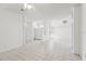 Open-concept living area featuring tile floors, high ceilings, and neutral paint throughout at 515 Torres Pl, Lady Lake, FL 32159