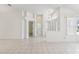 Spacious living room with vaulted ceilings, tile floors, and an open layout at 515 Torres Pl, Lady Lake, FL 32159