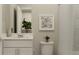 Clean bathroom with white vanity, toilet and shower at 7310 Ivy Tendril Ave, Orlando, FL 32829