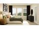 Bright and airy bedroom with large windows and en-suite bathroom at 7310 Ivy Tendril Ave, Orlando, FL 32829
