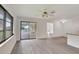 Bright living room featuring sliding glass doors to a patio at 10420 Vista Del Sol Cir, Clermont, FL 34711