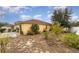 Backyard view showing home and landscaping at 1504 Fort Meade Pl, Poinciana, FL 34759