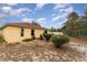 View of home's back and side yard at 1504 Fort Meade Pl, Poinciana, FL 34759