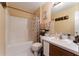 Clean bathroom with shower/tub combo and vanity at 1504 Fort Meade Pl, Poinciana, FL 34759