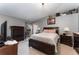 Bright bedroom with a large bed and plenty of dresser space at 1504 Fort Meade Pl, Poinciana, FL 34759