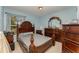 Charming bedroom with a double bed and decorative furniture at 1504 Fort Meade Pl, Poinciana, FL 34759