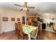 Bright dining room with a view of the kitchen and sliding doors to backyard at 1504 Fort Meade Pl, Poinciana, FL 34759