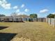 Large backyard with wooden fence and garden area at 20 Hemlock Trl, Ocala, FL 34472