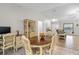 Bright dining room with wood table and chairs, view to living room at 20 Hemlock Trl, Ocala, FL 34472