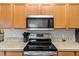 Stainless steel microwave and rangetop in the kitchen at 20 Hemlock Trl, Ocala, FL 34472