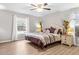 Main bedroom with king bed, light gray walls and LVP flooring at 20 Hemlock Trl, Ocala, FL 34472