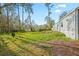 Large backyard with tire swing and partial view of the mobile home at 2519 State Park Rd, Lakeland, FL 33805