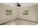 Bright bedroom with two windows and wood floors at 2519 State Park Rd, Lakeland, FL 33805