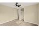 Spacious bedroom featuring wood-look floors and ceiling fan at 2519 State Park Rd, Lakeland, FL 33805