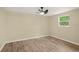 Spacious bedroom with wood flooring and ceiling fan at 2519 State Park Rd, Lakeland, FL 33805