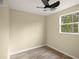 Cozy bedroom with wood-look floors and a window at 2519 State Park Rd, Lakeland, FL 33805