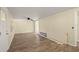 Living room with new wood-look flooring and ceiling fan at 2519 State Park Rd, Lakeland, FL 33805