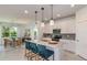 Modern kitchen with white cabinets, granite countertops, and stainless steel appliances at 6805 Sw 90Th Loop, Ocala, FL 34476