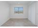 Bright and airy living room featuring neutral tile flooring, window with blind, and recessed lighting at 6805 Sw 90Th Loop, Ocala, FL 34476