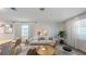 Bright living room featuring a light beige sofa and coffee table at 1922 Rider Rain Ln, Apopka, FL 32703