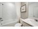 Clean bathroom featuring a tiled shower-tub combo and modern vanity at 6825 Sw 90Th Loop, Ocala, FL 34476