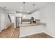 Modern kitchen with white cabinets and granite countertops at 1509 Sweet Apple St, Oakland, FL 34787