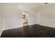 Well-lit bedroom with luxury vinyl floors, wainscoting, and an archway leading to the Primary bathroom at 2504 Davenport Cir, Kissimmee, FL 34746