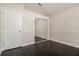 Bedroom with dark wood floors and sliding mirrored closet doors at 2504 Davenport Cir, Kissimmee, FL 34746