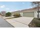 Attached garage with additional parking and curb appeal at 2804 Grasmere View Pkwy, Kissimmee, FL 34746