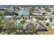 Aerial view showcasing home's location in a residential neighborhood near a lake at 3723 Madbury Cir, Lakeland, FL 33810