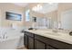 Double vanity bathroom with a soaking tub and shower at 3723 Madbury Cir, Lakeland, FL 33810