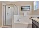 Bathroom with a soaking tub and a walk-in shower at 3723 Madbury Cir, Lakeland, FL 33810