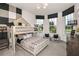 Unique ' bedroom featuring a bunk bed with a playhouse frame, patterned bedding, and dual windows at 6785 Sw 90Th Loop, Ocala, FL 34476