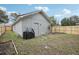 Large backyard with a storage shed and grill at 209 W Highland St, Lakeland, FL 33803