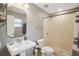 Clean bathroom with a walk-in shower and pedestal sink at 209 W Highland St, Lakeland, FL 33803