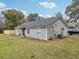 Charming house with gray siding and landscaped yard at 209 W Highland St, Lakeland, FL 33803