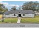 Renovated home with gray siding and landscaping at 209 W Highland St, Lakeland, FL 33803