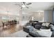 Open concept living area with gray sectional and hardwood floors at 209 W Highland St, Lakeland, FL 33803