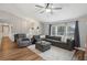 Open concept living room with gray sectional and hardwood floors at 209 W Highland St, Lakeland, FL 33803