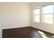 Bright bedroom with dark flooring and two windows at 430 Stillwater Ln, Haines City, FL 33844