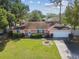 Aerial view of single Gathering home showing landscaping, driveway and front yard at 683 Anderson Dr, Deltona, FL 32725