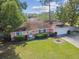 Aerial view of the house showcasing the front yard and landscaping at 683 Anderson Dr, Deltona, FL 32725