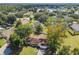 Lakeside suburban neighborhood with single-Gathering homes surrounded by mature trees and lush landscaping at 683 Anderson Dr, Deltona, FL 32725